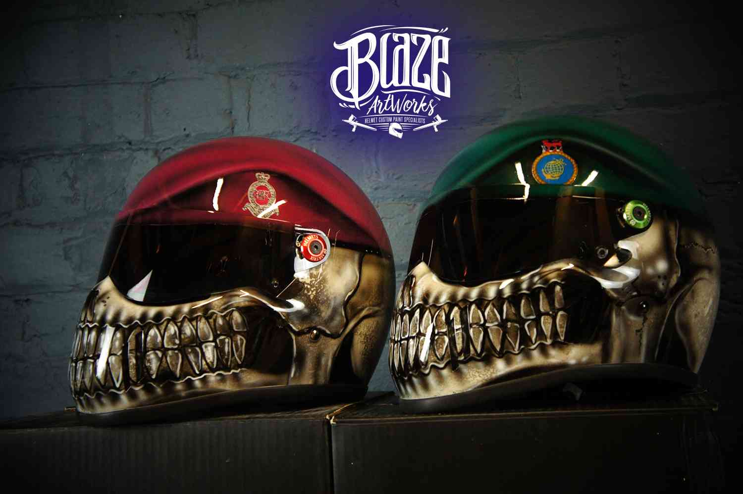 Two skull motorcycle helmets with military berets, red and green colors, detailed teeth and eye sockets, professional airbrush work