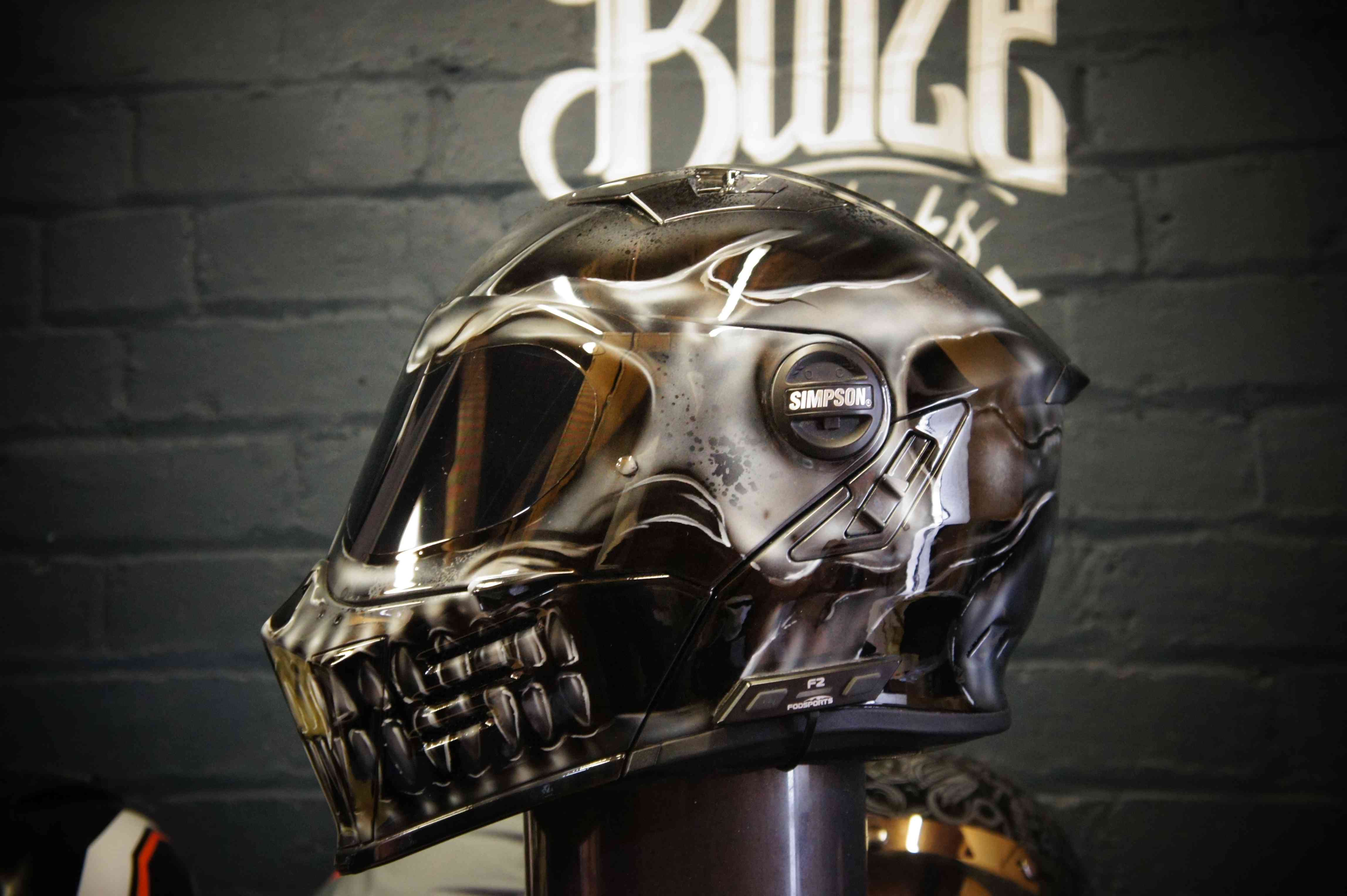Chrome metallic skull motorcycle helmet with realistic anatomical details, glossy reflective finish and death head design