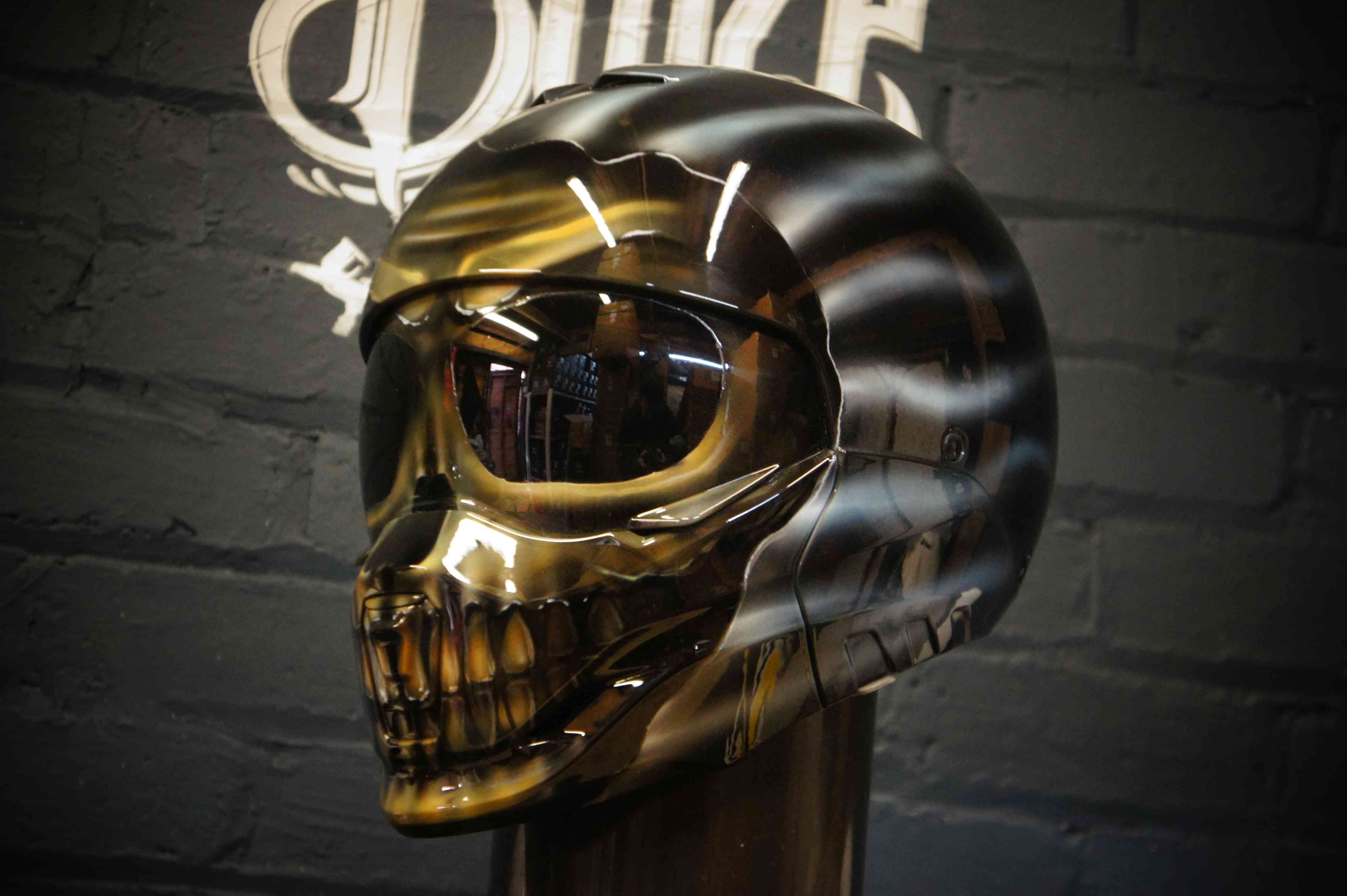 Glossy chrome skull motorcycle helmet with metallic finish, realistic bone structure, hollow eye sockets, detailed teeth