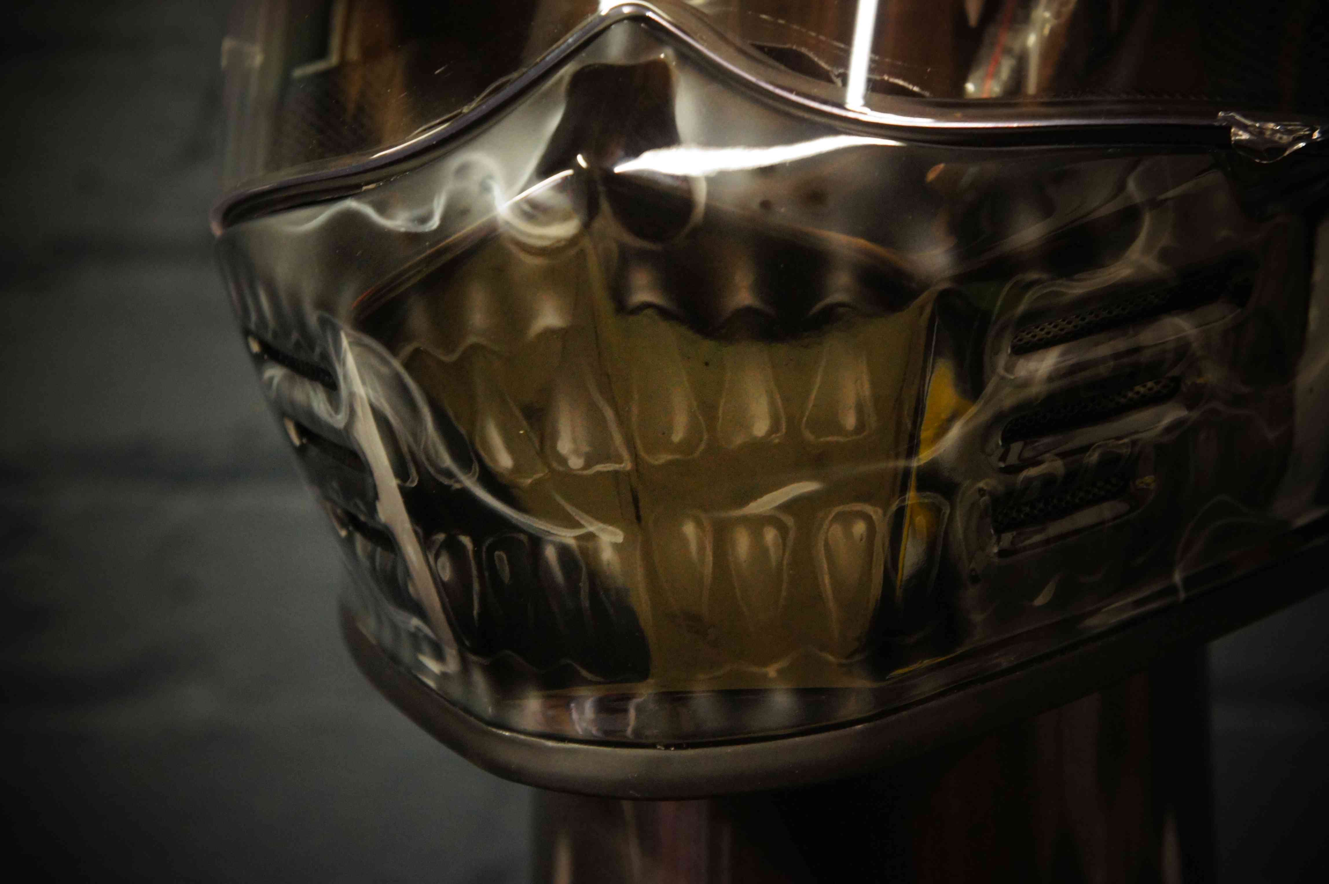 Photorealistic anatomical skull design airbrushed on motorcycle helmet showing detailed jaw, teeth and bone structure