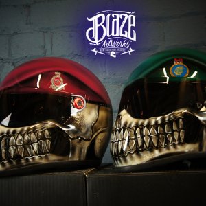 Two skull motorcycle helmets with military berets, red and green colors, detailed teeth and eye sockets, professional airbrush work
