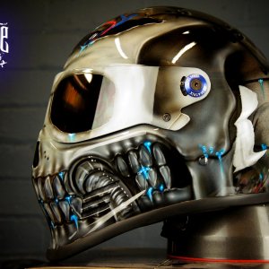 Metallic silver robot skull helmet with chrome finish, blue LED-style glowing details, mechanical jaw design and futuristic cyborg styling