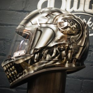 Photorealistic chrome skull motorcycle helmet with metallic silver finish, detailed skeletal features, jaw and eye sockets
