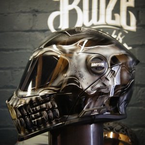 Chrome metallic skull motorcycle helmet with realistic anatomical details, glossy reflective finish and death head design