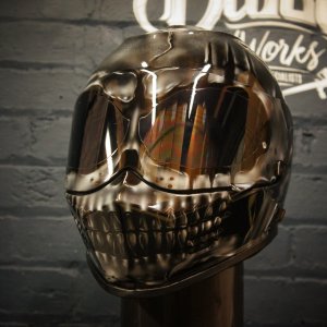 Chrome metallic skull motorcycle helmet with reflective silver finish, detailed anatomical skull face with jaw and teeth painted