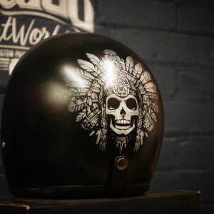 Black motorcycle helmet with detailed white Native American chief skull wearing feathered headdress custom airbrush artwork