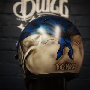 Custom painted motorcycle helmet featuring realistic 3D skull design in blue and cream colors with Big Mike memorial text