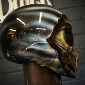 Stunning chrome-effect skull motorcycle helmet with realistic metallic silver finish and detailed anatomical features