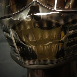 Photorealistic anatomical skull design airbrushed on motorcycle helmet showing detailed jaw, teeth and bone structure