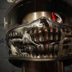 Chrome metallic skull jaw design airbrushed on black motorcycle helmet with realistic anatomical teeth and bone structure