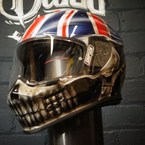 Chrome metallic skull helmet with Union Jack flag design, realistic anatomical skull features with British flag painted on top